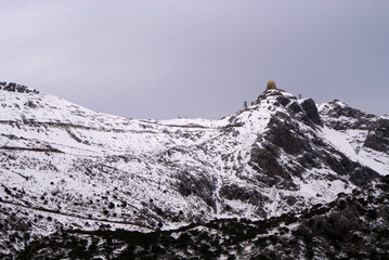 View of white Puig Major and military base with radar at summit, snow covered Serra de Tramuntana mountains, Escorca, Mallorca. Snowy excursion, winter season, mallorcan landscape, nature.