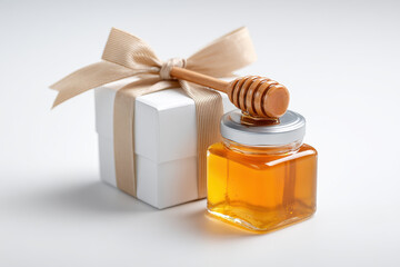 Delightful gift set exudes elegance jar full honey next to gift box. This premium set looks desirable, simple aesthetic makes feel so special