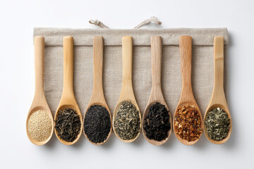 Assortment of various teas displayed on wooden spoons evokes sense of warmth and well being, inviting exploration and enjoyment