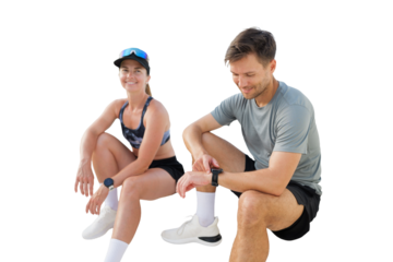 Couple enjoying a break during a fitness session outdoors