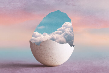 Cracked egg revealing blue sky and flowing clouds in a dreamy collage