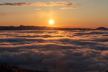 Dawn at Bihoro Pass as the sun rises through the sea of clouds