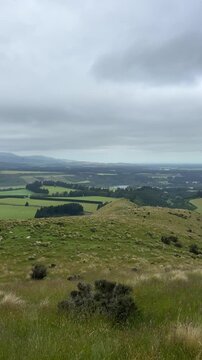 Landscape with clouds and a blue river in the distance, Springfield, New Zealand