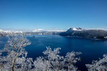 Lake Mashu and sparkling frost-covered trees