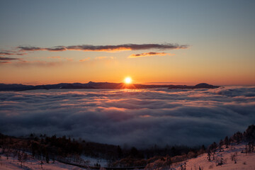 The dawn of Bihoro Pass, where the sun rises through the sea of clouds
