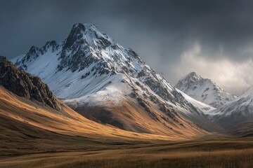 Majestic snow-capped mountains under dramatic skies.