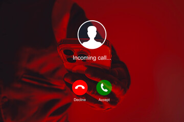 Incoming call graphic interface design overlaid on a smartphone with red neon studio lighting. A...