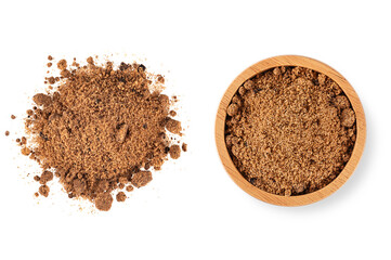 Brown unrefined cane sugar in wooden bowl isolated on white background. top view
