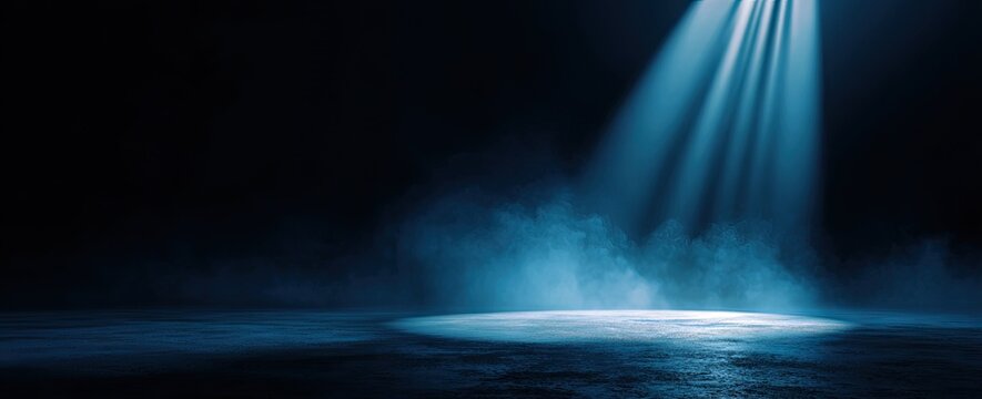 Dark stage lit by a bright spotlight