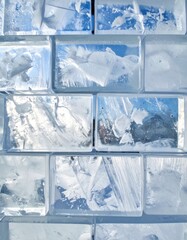 Detailed Close Up of a Blue Tinted Ice Block Wall Showing Winter Texture