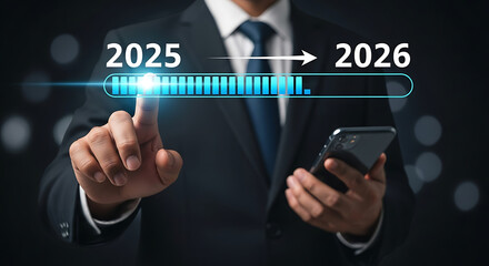 Businessman touching screen indicating progress from 2025 to 2026 with loading bar