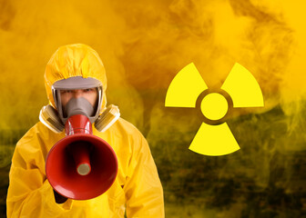 Man in hazmat suit and gas mask warning about radioactive danger using megaphone. Polluted city in...