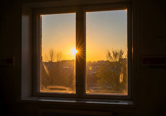 Golden sunset view through a window