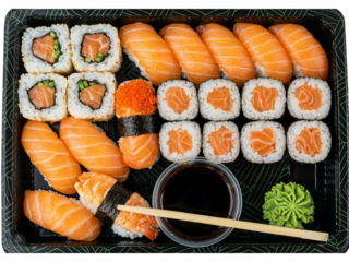 Delicious assortment of fresh salmon sushi rolls and nigiri presented in a black takeaway container with soy sauce and wasabi isolated on transparent background
