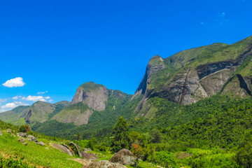 Fototapeta premium Tres Picos nature park in Brazil with granite mountain peaks, lush forest and natural landscape. Towering rock formations hiking, climbing, tourism area scenic wilderness in Brazil near Rio de Janeiro
