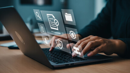 Person typing on laptop with digital interface icons floating above keyboard hands computer 1