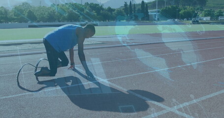 Kneeling athlete in gear placing hand and foot on track start line, gripping carbon fiber blade