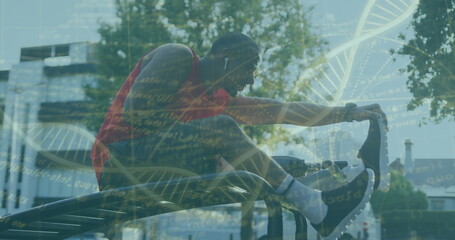Red-shirted man stretching right leg on parallel bar in park, with earbuds, trainers, DNA overlay