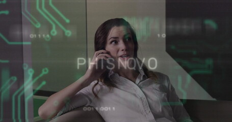 Reclining woman wearing white shirt speaking on smartphone on office sofa, digital circuit graphics