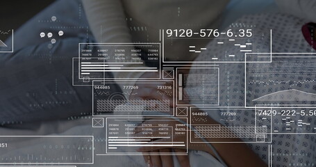 Holding smartphone parent and child analyzing data overlays on bed, with digital interface elements