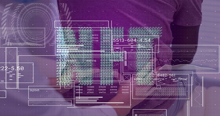 Analyzing digital data overlays team standing behind office desk, with tablet, coffee mug, laptop