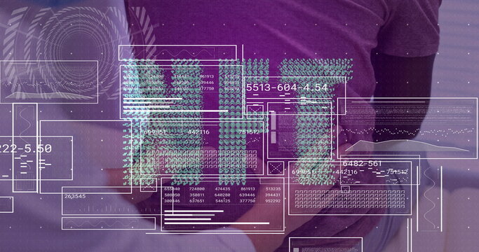 Analyzing digital data overlays team standing behind office desk, with tablet, coffee mug, laptop
