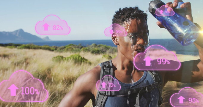 Runner in tank top pouring water from water bottle on coast with hydration pack, pink icons - Powered by Adobe