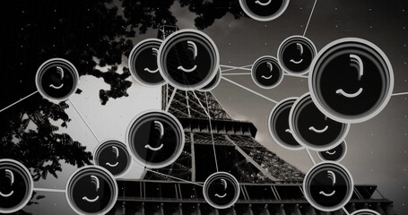 Featuring Eiffel Tower rising from base in Paris night sky, with network web and tree branches