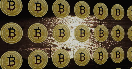 Shimmering golden Bitcoin coin icons floating over rippling water at sunset, cryptocurrency theme