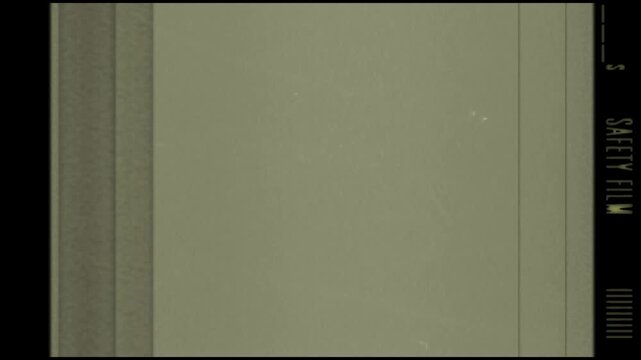 Grainy film strip labeled safety film, ideal for vintage or retro design projects seeking an authentic film aesthetic. Great for filmthemed content.