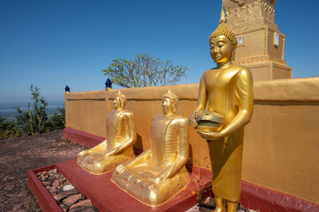 Buddha statues situated in the area of Luang Pu Wang pagoda on Phu Langka mountain in Bueng Kan province of Thailand. This site is a prime viewpoint to watch the sunrise and landscape as far as Laos.