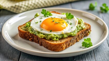 Crispy brown bread with creamy green guacamole and a sunny-side up golden yolk