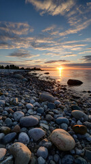 Serene Sunset Over Pebbled Shoreline