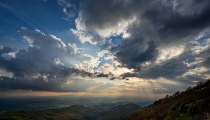 moody sky with sunlight filtering through layers of clouds casting soft diffused light the scene captures the serene yet powerful atmosphere created by the interplay of light and shadow