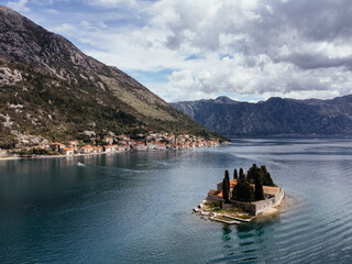 Aerial view of Saint George Island near Perast in the Bay of Kotor, Montenegro, surrounded by calm...