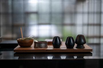 Matcha tea ceremony set on wooden tray showing tranquility and mindfulness