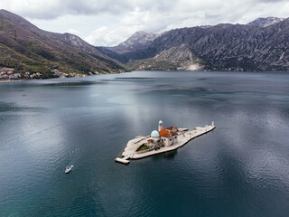Aerial view of Saint George Island near Perast in the Bay of Kotor, Montenegro, surrounded by calm...
