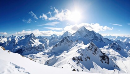 Obraz premium Sunburst Over a Majestic, Endless Expanse of Snowy Mountain Peaks