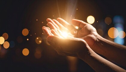 Open hands cupping a bright, ethereal light source, with bokeh lights softly illuminating the dark background.