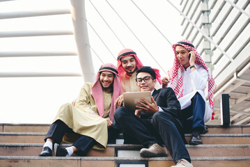 Multicutural Group of people diversity men talking look at digital tablet smile face. Empowering...