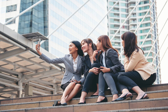 Businesswomen Partner use digital tablet online meeting team Partnership businesswoman talking together. Diversity group Asian Business women Partner trust teamwork. Asian Business team using tablet