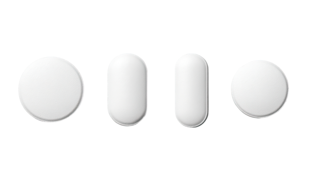 Four white pills of varying shapes, circular and oval, displayed in a row