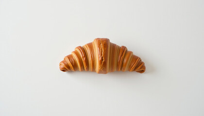Delicious croissant with smooth caramel glaze on minimalist white background, evoking sense of indulgence and simplicity