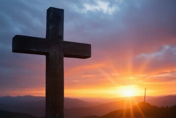 Sunlit wooden cross on hilltop overlooking mountains, creating serene and peaceful atmosphere with sunset hues and warm glow.