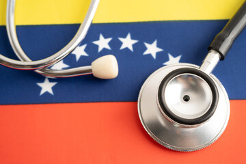 Stethoscope on Venezuela flag, business and finance.