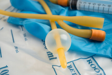 Foley urinary catheter with urine bag for disability or patient in hospital.