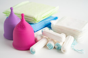 Menstruation cycle with sanitary pad and cotton tampon for woman hygiene and protection.