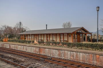 March 25 2025 Charming Rural Train Station with Platform and Scenic Background, Japan