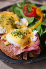 Breakfast with eggs and ham on a rustic plate
