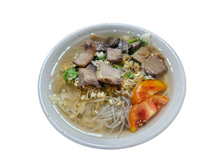 A bowl of traditional Indonesian beef noodle soup served with fresh vegetables and tomato slices, perfect for culinary and food industry visuals. Isolated on white background, transparent PNG, cut out
